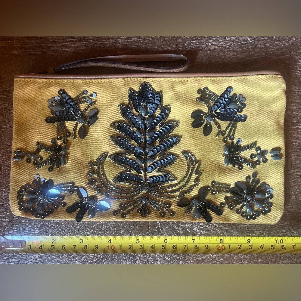 Live. Love. Loft. embellished canvas clutch with leather trim